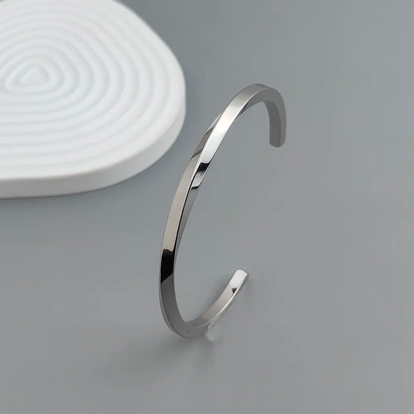 Metal lady's bracelet. Simple opening rotating rhombic stainless steel brooch. Jewelry for the wife's wedding party.