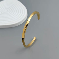 Metal lady's bracelet. Simple opening rotating rhombic stainless steel brooch. Jewelry for the wife's wedding party.